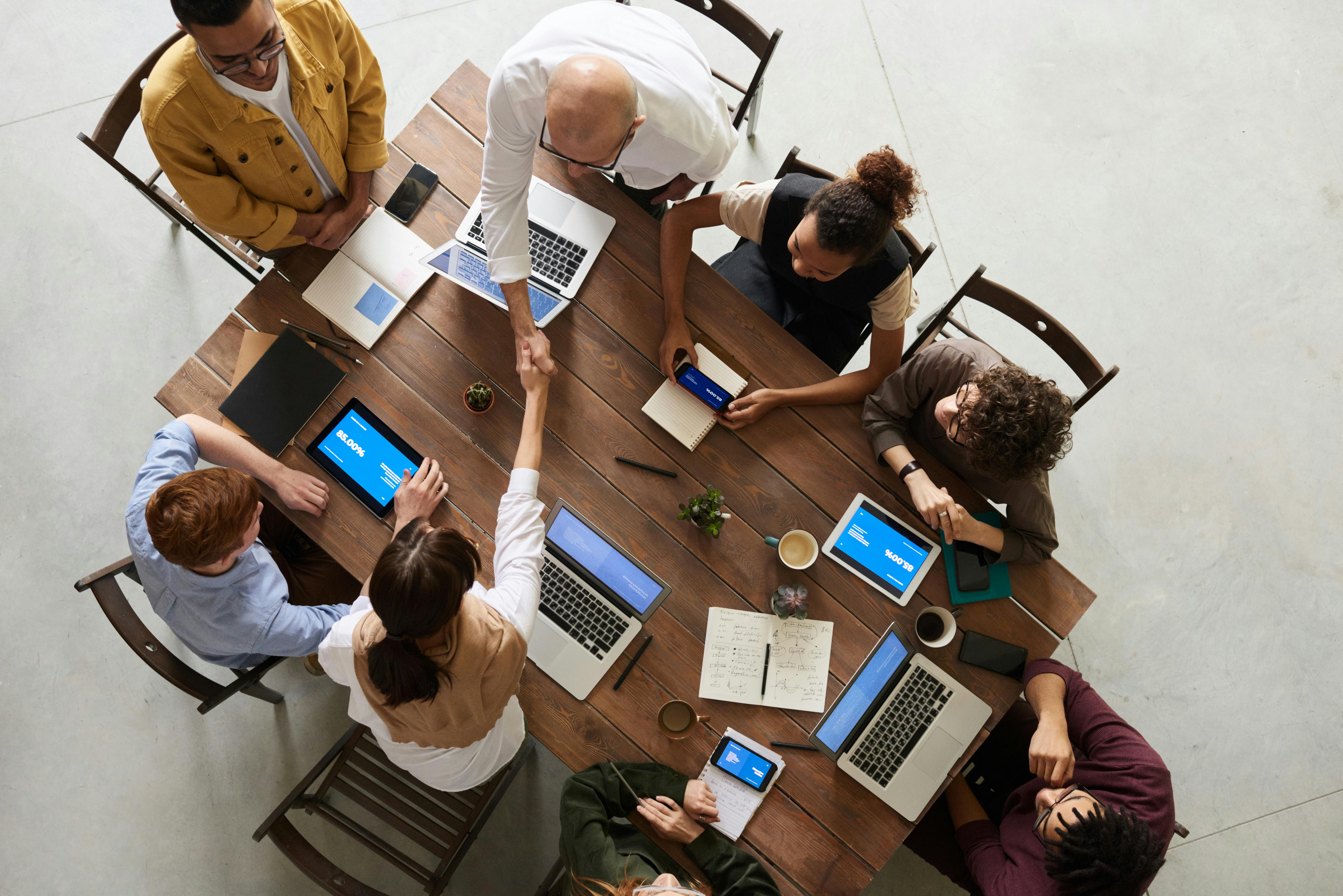 team picture of people making an agreement